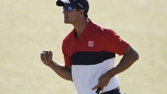 Adam Scott celebrates