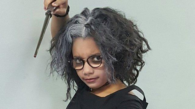 Ten-year-old Aliyah, from Staffordshire, is dressed as Bellatrix Lestrange from Harry Potter with a homemade wand!