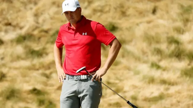 Jordan Spieth reacts after a putt