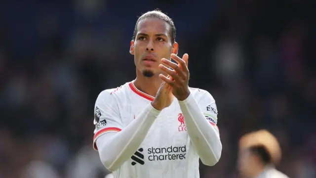 Virgil van Dijk of Liverpool applauds the fans