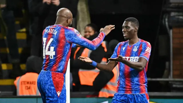 Crystal Palace's Senegalese midfielder #07 Ismaila Sarr (R) celebrates with Crystal Palace's French striker #14 Jean-Philippe Mateta after scoring his team first goal during the English Premier League football match between Crystal Palace and Arsenal at Selhurst Park