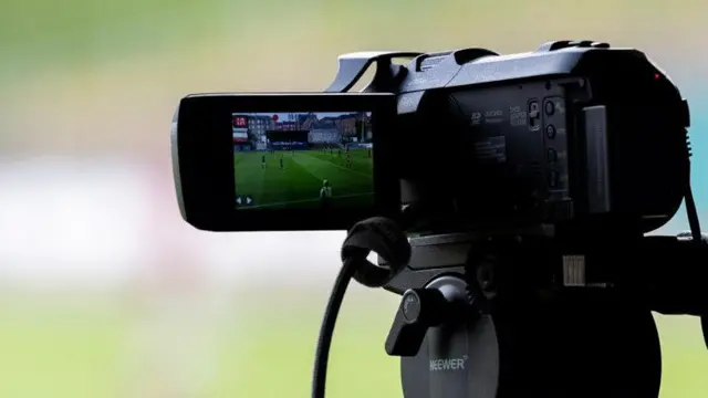 Camera at football match