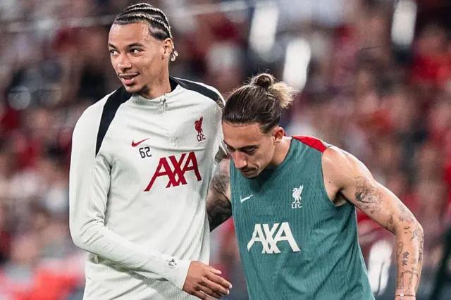 Hugo Ekitike and Kostas Tsimikas during a Liverpool training session in Hong Kong