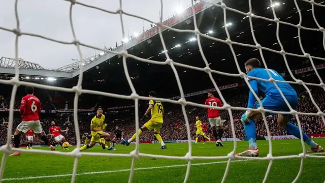 Manchester United forward Bryan Mbeumo (second left) scores the opening goal against Tottenham at Old Trafford