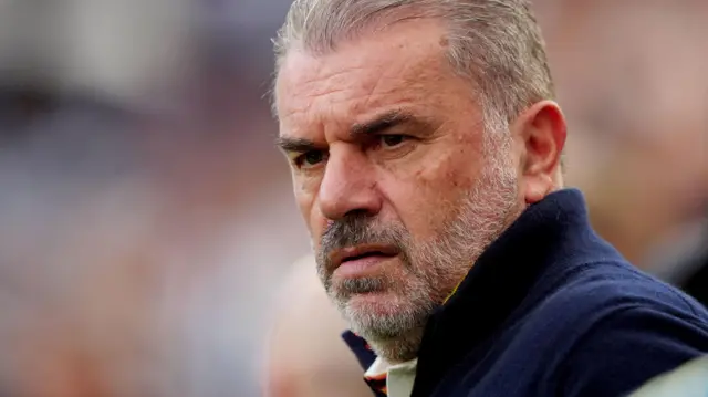 A close-up of Ange Postecoglou looking serious