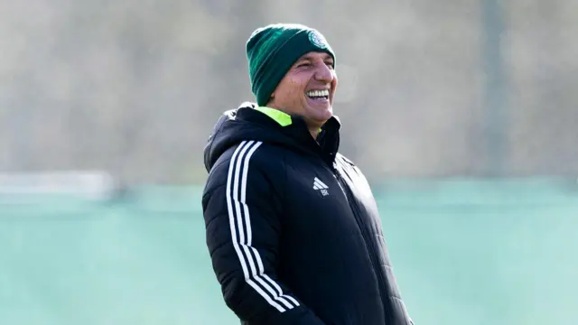 Celtic manager Brendan Rodgers laughs during a training session