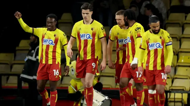 Watford players celebrate with goalscorer Marc Bola 