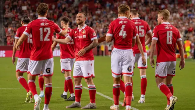 Jack Marriott celebrates in pre-season with Wrexham team-mates