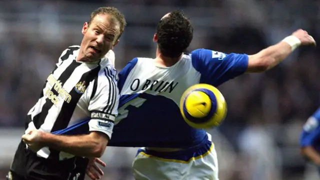 Newcastle United's Alan Shearer challenges Andy O'Brien of Portsmouth