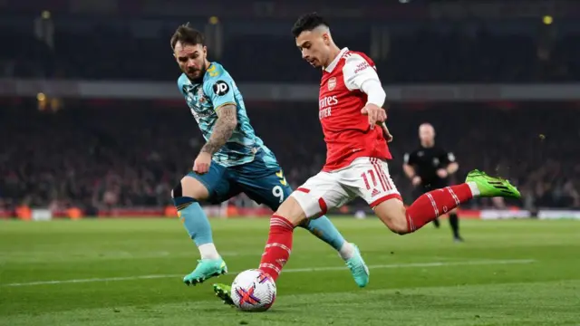 Southampton's Adam Armstrong and Arsenal's Gabriel Martinelli playing at the Emirates Staadium