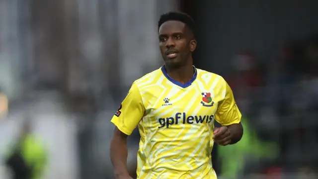 Jaydn Mundle-Smith torso and head shot looking ahead, wearing Wealdstone's yellow away kit