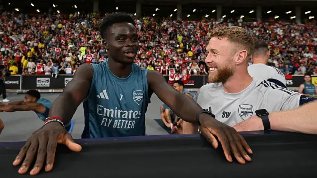 Sam Wilson pictured with Bukayo Saka 