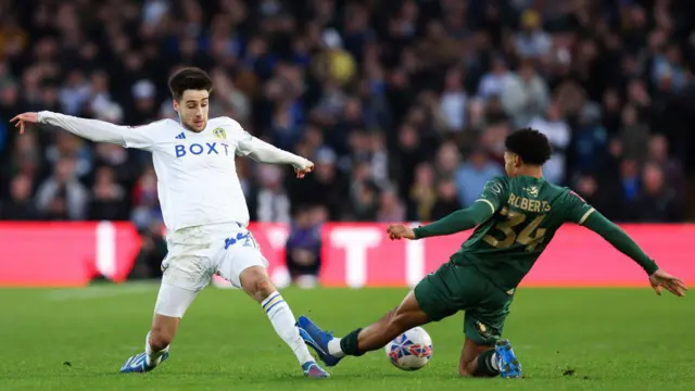 Ilia Gruev of Leeds United battles for possession with Caleb Roberts of Plymouth Argyle