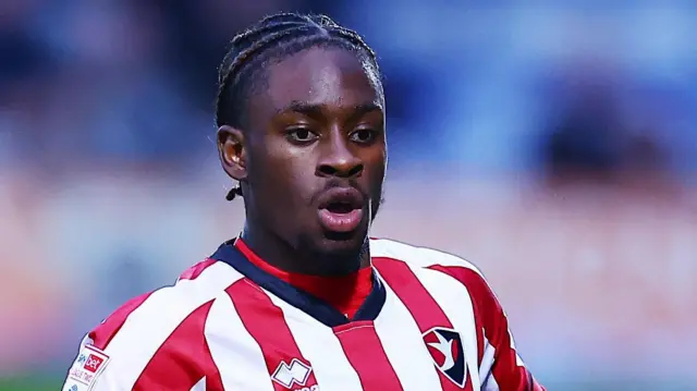 Ethon Archer with his mouth open while playing for Cheltenham