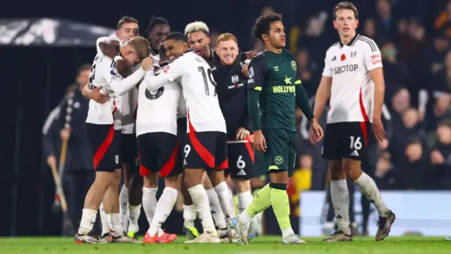 Fabio Carvalho walks away after Fulham celebrate their last second winner