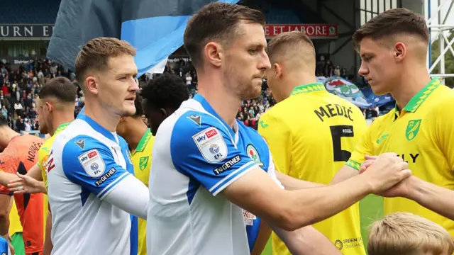 Dom Hyam shakes hands with Norwich players on what proved his final appearance for Blackburn