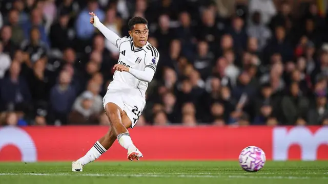 Josh King of Fulham passes the ball