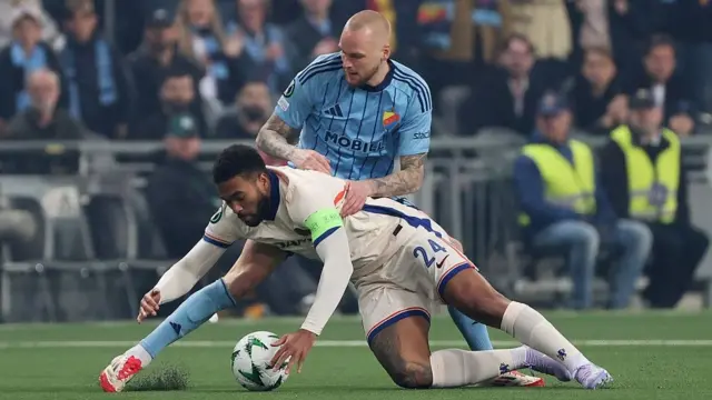 Reece James competes for the ball