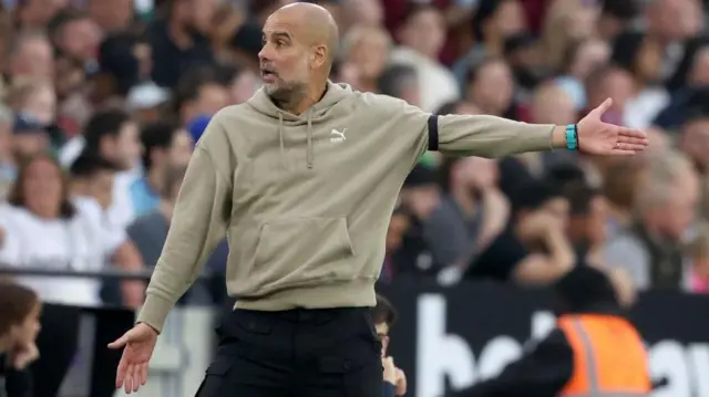 Pep Guardiola on the touchline during Manchester City's Premier League game at West Ham