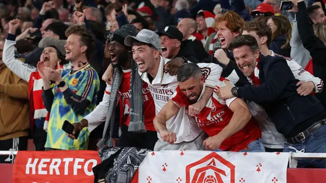 Arsenal supporters celebrate victory
