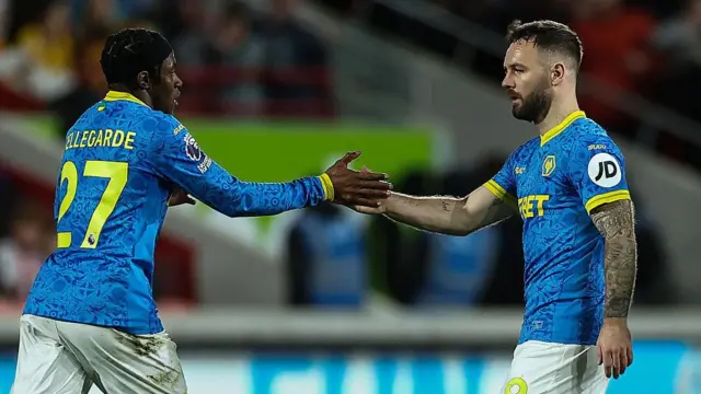 Wolverhampton Wanderers' Adam Armstrong celebrates scoring his side's first goal with team mate Jean-Ricner Bellegard