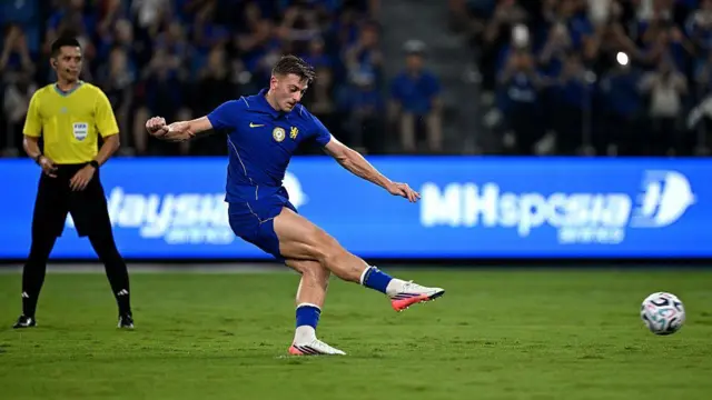 Liam Delap of Chelsea scores his team's second goal from the penalty spot