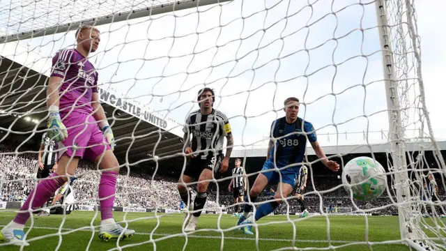 Adrien Truffert of AFC Bournemouth reacts after scoring his team's second goal as Sandro Tonali and Aaron Ramsdale of Newcastle United appear dejected