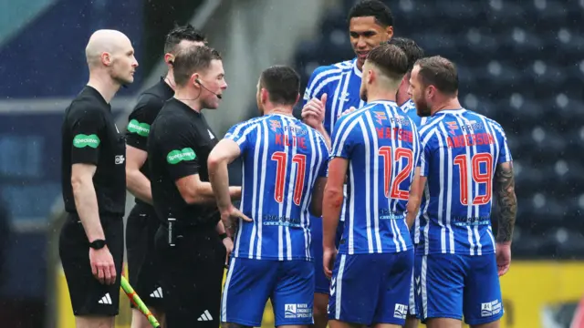 Kilmarnock players remonstrate with referee John Beaton