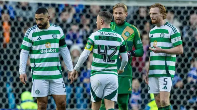 Celtic players in discussion at Ibrox
