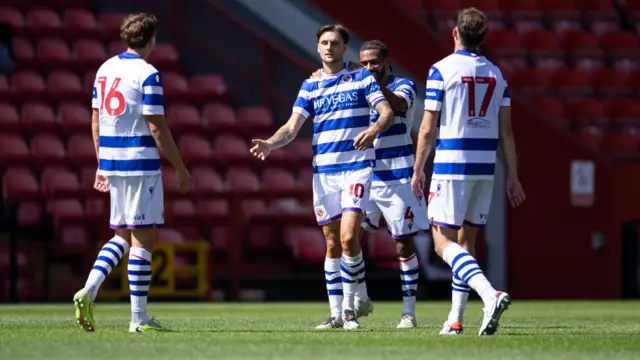 Reading players celebrate after scoring a goal in a friendly