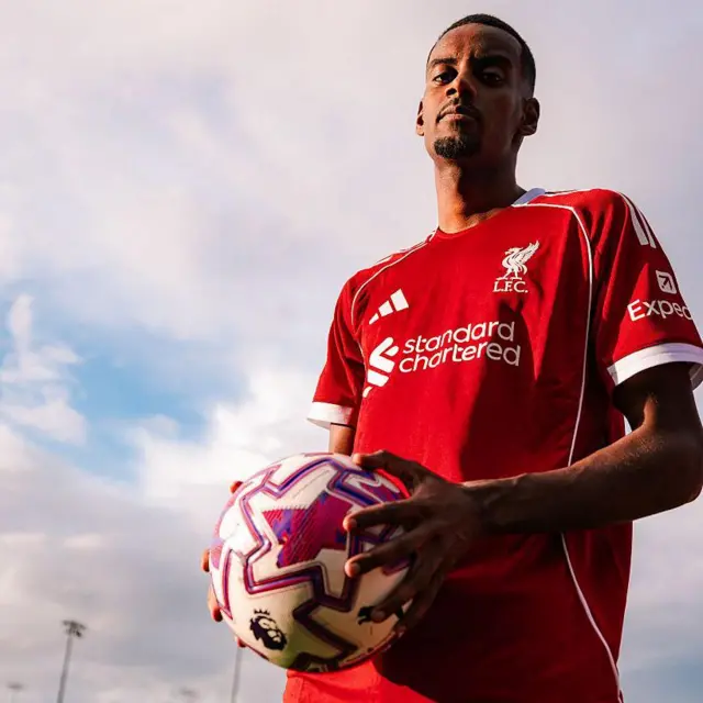 Alexander Isak holds a ball