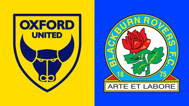 The club badges of Oxford United and Blackburn Rovers side by side. The Blackburn one shows an ox drawn in blue inside a shield with Oxford United written above it on a yellow background. Blackburn have a red rose inside a light blue circle with Blackburn Rovers FC written in yellow inside it