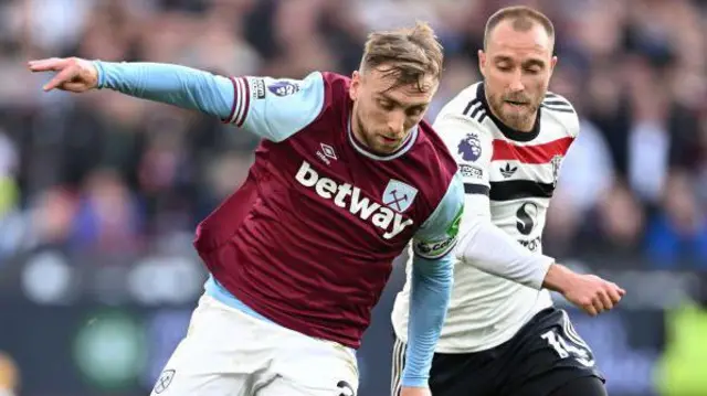 Jarrod Bowen of West Ham United takes on Christian Eriksen of Manchester United during the Premier League match between West Ham United FC and Manchester United FC at London Stadium