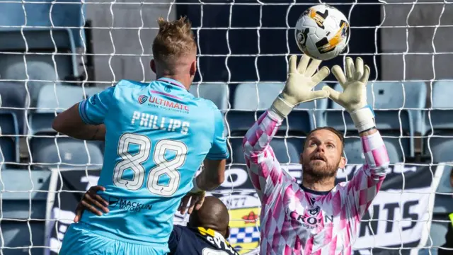 St Mirren goalkeeper Trevor Carson makes a save