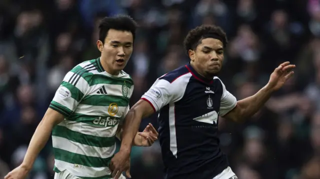Celtic's Hyunjun Yang and Falkirk's Kyrell Wilson