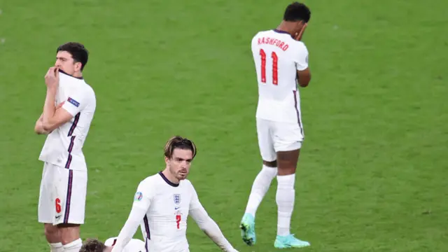 Harry Maguire, Jack Grealish and Marcus Rashford looking dejected after England lost to Italy in the final of Euro 2020