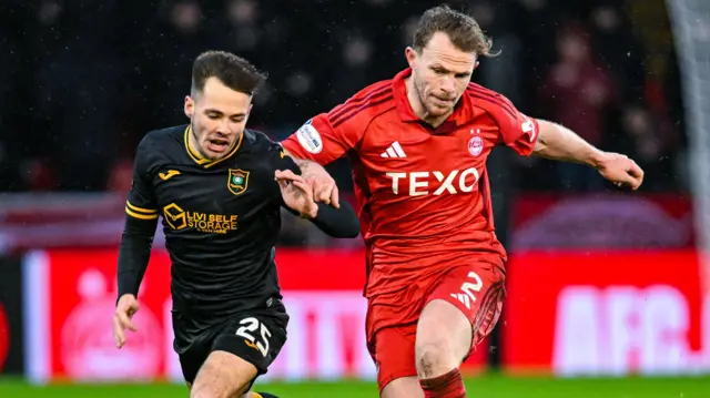 Livingston's Macaulay Tait and Aberdeen's Nicky Devlin