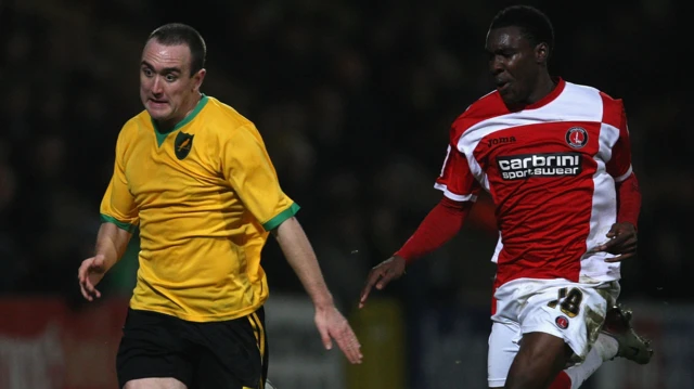 Lee Croft running on pitch with Charlton player