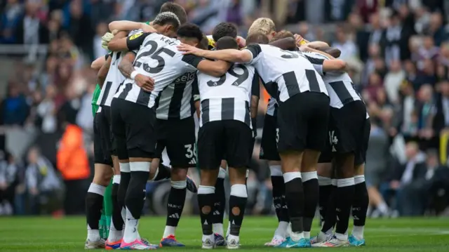 The Newcastle United players form a huddle before the Premier League match between Newcastle United and Tottenham Hotspur at St James' Park. 