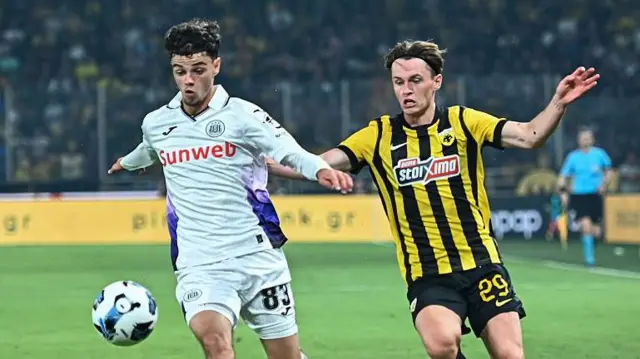 AEK Athens' James Penrice (right) in action