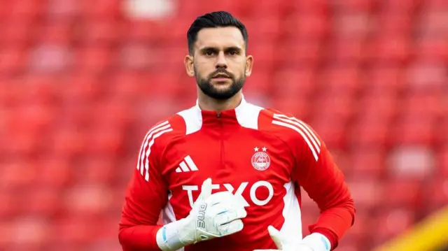 Aberdeen's Dimitar Mitov warms up during a Premier Sports Cup group stage match between Aberdeen and Airdrieonians at Pittodrie Stadium, on July 23, 2024, in Aberdeen, Scotland.  (Photo by Craig Foy / SNS Group)