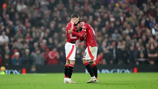 Alejandro Garnahco and Bruno Fernandes celebrate for Manchester United