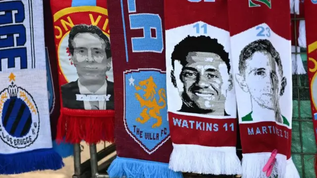 Aston Villa merchandise - scarves with Emery's face and Watkins' face on