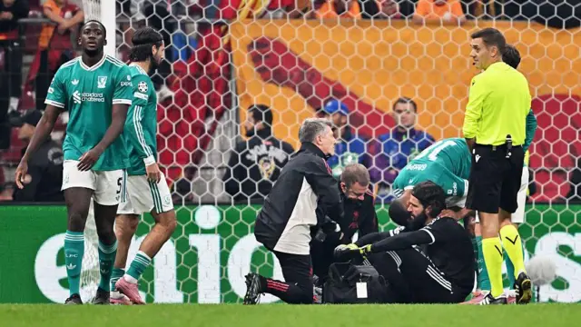 Alisson receiving treatment on the pitch during Liverpool's defeat by Galatasaray