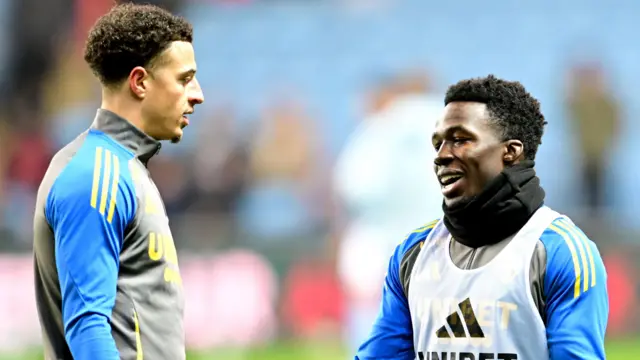 Leeds United's Ethan Amapdu and Willy Gnonto talking during training