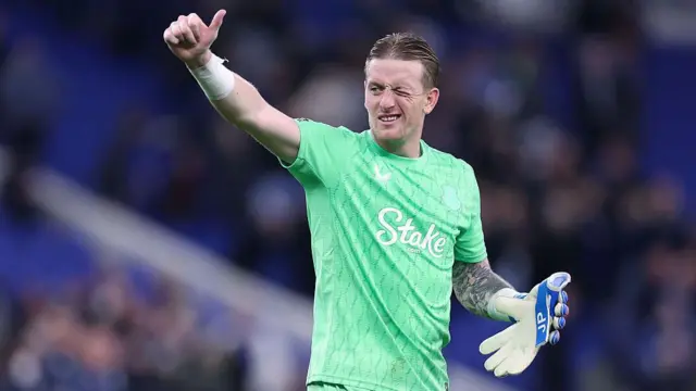 Everton goalkeeper Jordan Pickford gives a thumbs up to supporters
