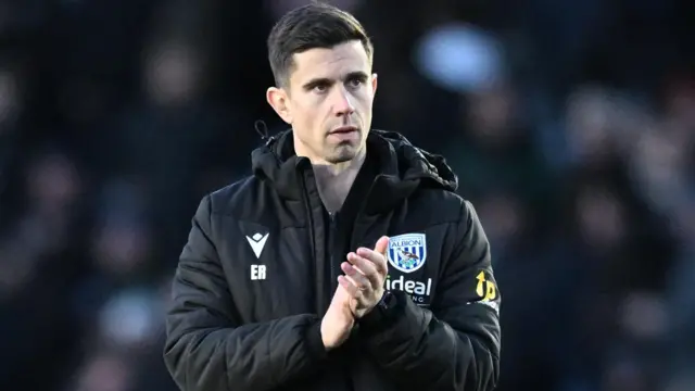 West Brom boss Eric Ramsay applauds supporters after a game