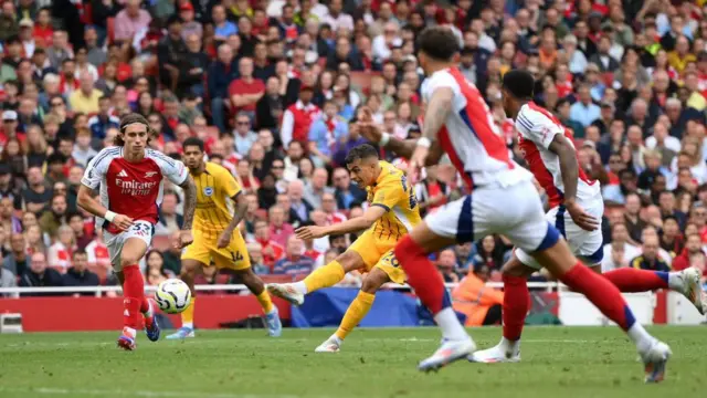 Yasin Ayari of Brighton & Hove Albion has a shot saved