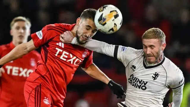 Aberdeen's Adil Aouchiche and Dundee United's Craig Sibbald