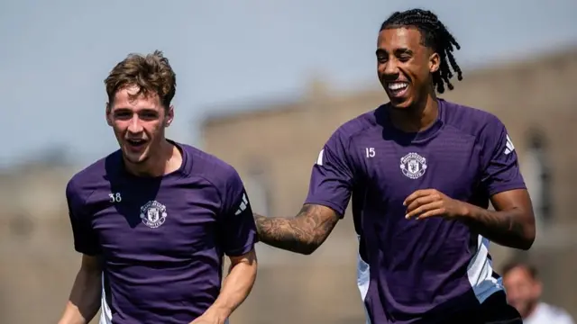 Manchester United defender Leny Yoro (right) with Jack Fletcher at training